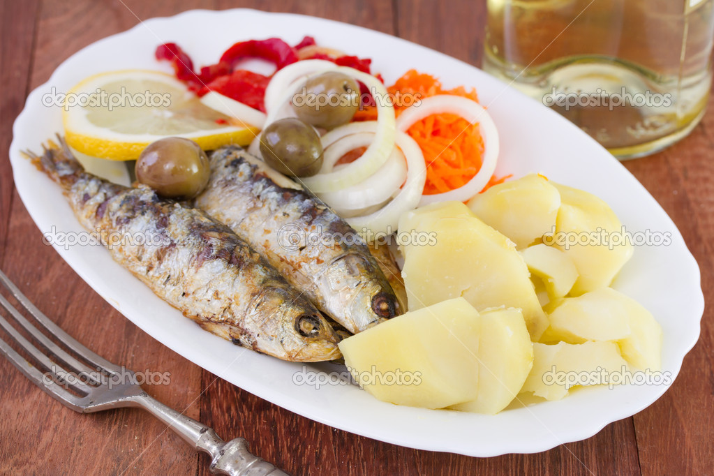 Fried sardines on white dish