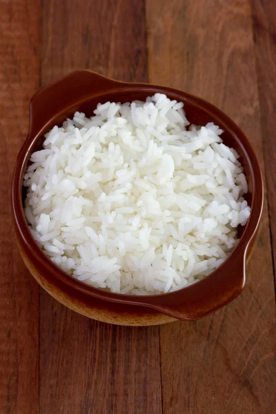 Boiled rice in dark bowl — Stock Photo, Image