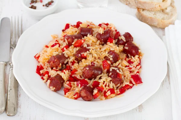 Rice with sausages and pepper on the white plate — Stock Photo, Image