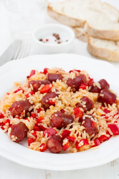 Rice with sausages and pepper on the white plate — Stock Photo, Image