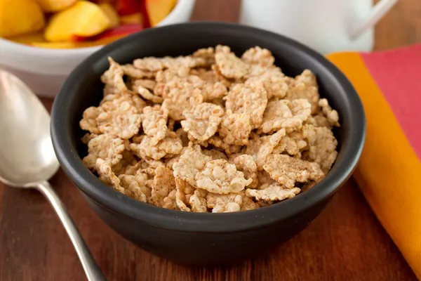 Cereals in black bowl — Stock Photo, Image