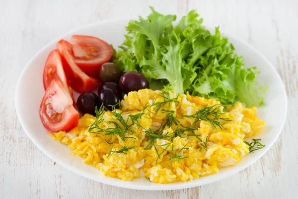 Egg with salad on the white plate — Stock Photo, Image