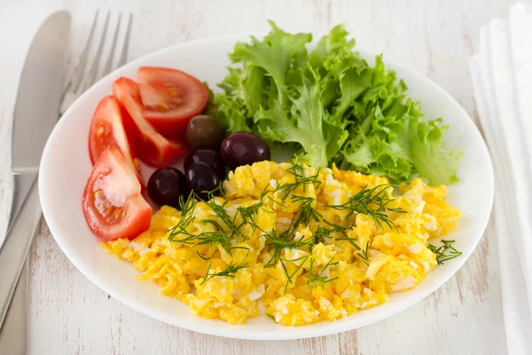 Egg with salad on the white plate — Stock Photo, Image