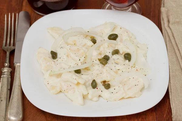 Potato salad on white plate — Stock Photo, Image
