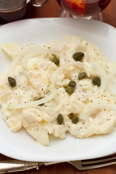 Potato salad on white plate — Stock Photo, Image