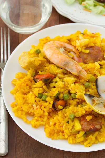 Paella on white plate — Stock Photo, Image