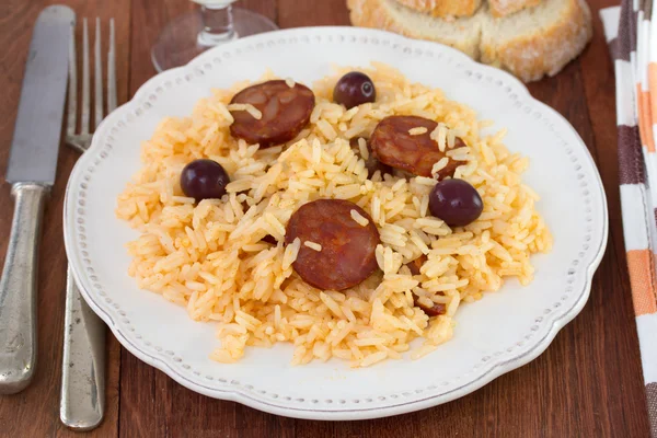 Rice with sausages on the white plate — Stock Photo, Image