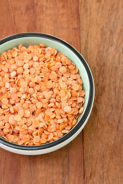 Dry lentil in bowl — Stock Photo, Image