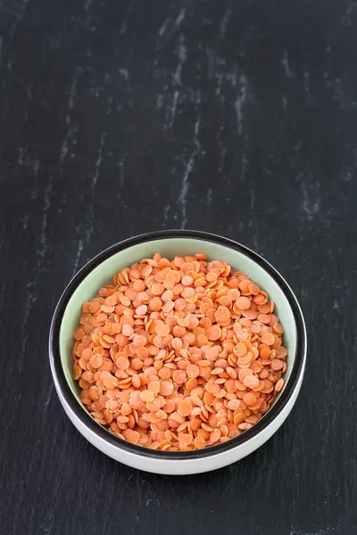 Dry lentil in bowl — Stock Photo, Image