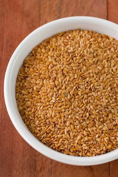 Linseed in white bowl — Stock Photo, Image