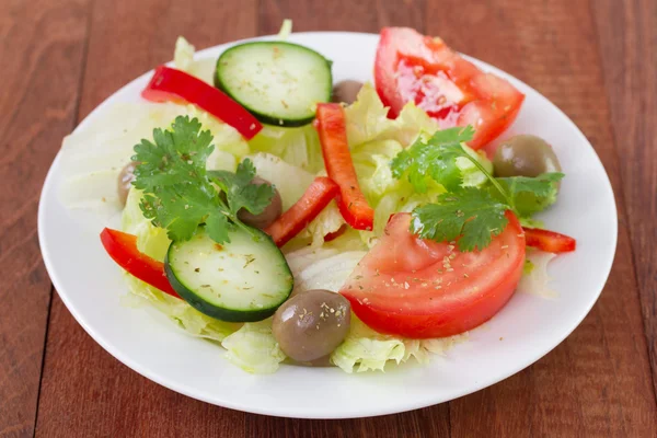 Salad on white plate — Stock Photo, Image