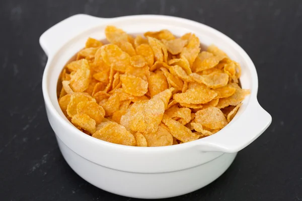 Cornflakes in white bowl — Stock Photo, Image