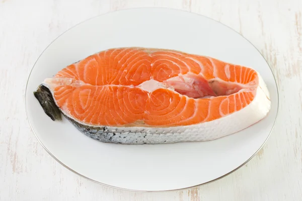 Fresh salmon on white plate — Stock Photo, Image