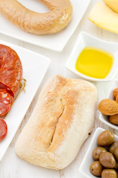 Bread with sausages and olives — Stock Photo, Image