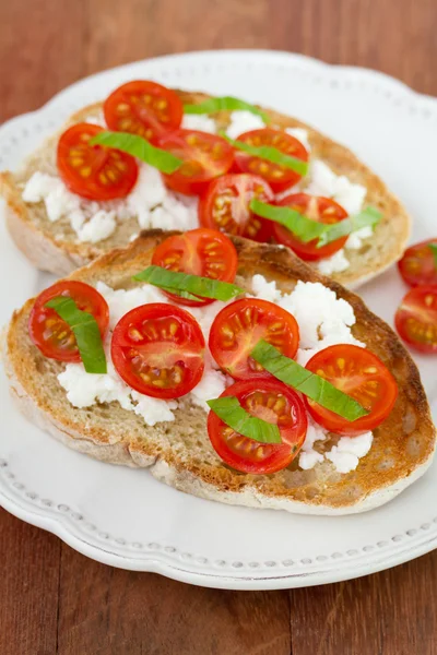 Sandwich with tomato on plate — Stock Photo, Image