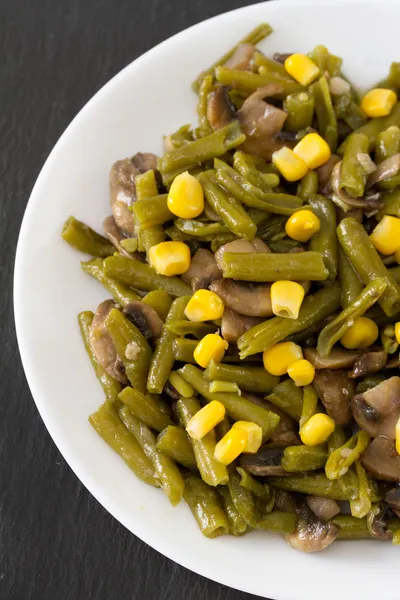 Green beans with mushrooms and corn on plate — Stock Photo, Image