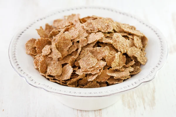 Flakes in white plate — Stock Photo, Image