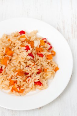 Boiled rice with vegetables on plate