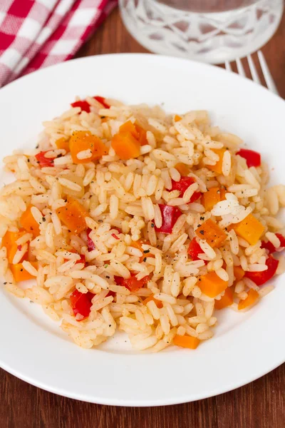 Boiled rice with vegetables on plate — Stock Photo, Image