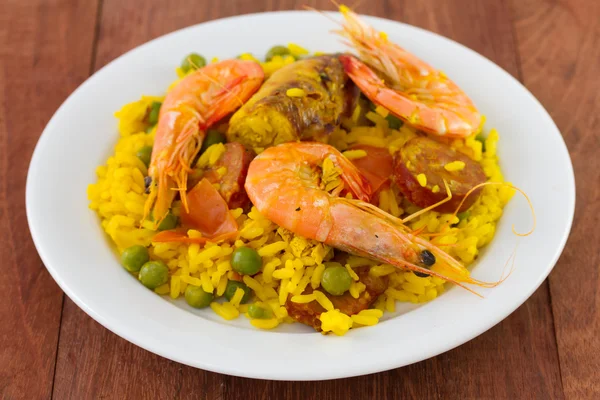 Paella on white plate — Stock Photo, Image