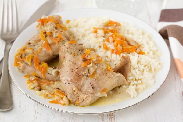 Rabbit with carrot and rice on plate — Stock Photo, Image