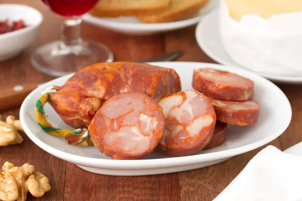 Sausages on white plate — Stock Photo, Image