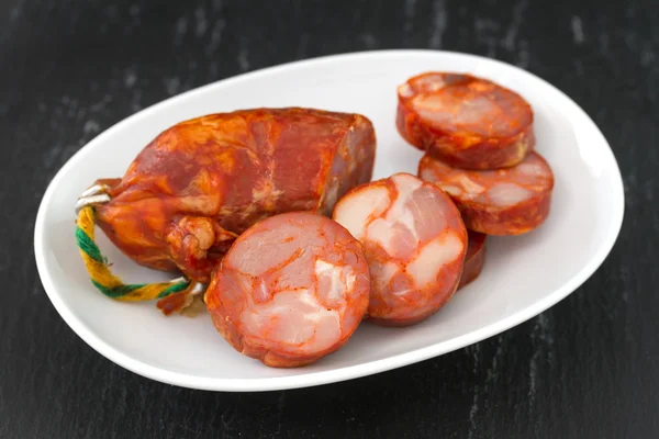 Chorizo on white dish — Stock Photo, Image