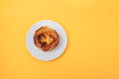 typical portuguese egg tart pastel de nata on white dish