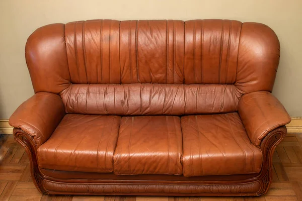 old light brown leather sofa in an old room