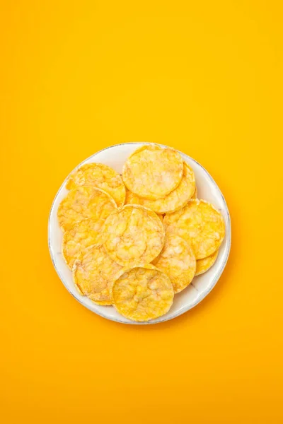 Small mini crispy corn diet toasts on white dish — Stock Photo, Image