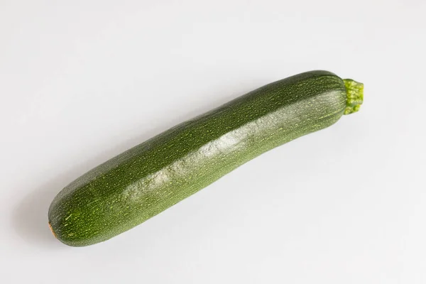 One Green Uncooked Courgette Gray Paper — Stock Photo, Image