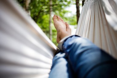 Relaxing in hammock clipart