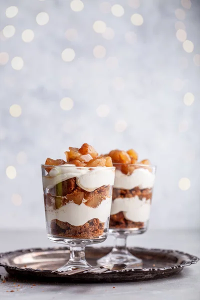 Christmas dessert with gingerbread cookies, cream and pears