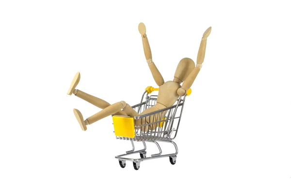 Muñeca femenina de madera en la locura de compras — Foto de Stock