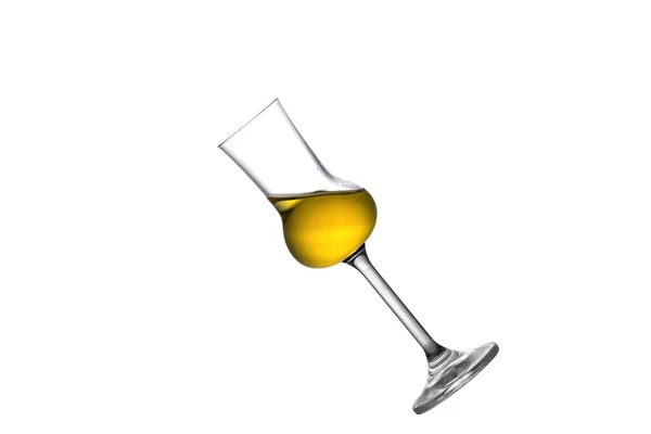 Een glas gekanteld grappa — Stockfoto