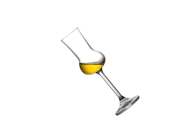 Un bicchiere di grappa inclinato — Foto Stock