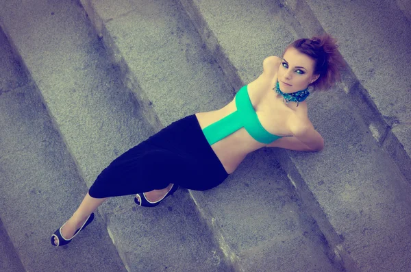 Sexy girl lying on stairs — Stock Photo, Image