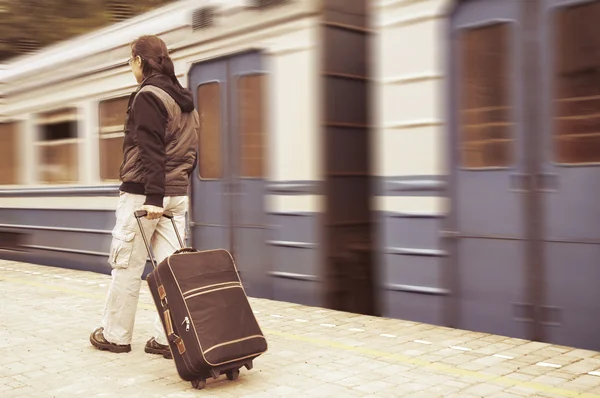 Walking passenger on a train station — Stock Photo, Image