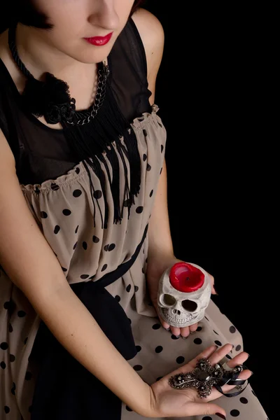 Halloween witch with a skull and cross — Stock Photo, Image