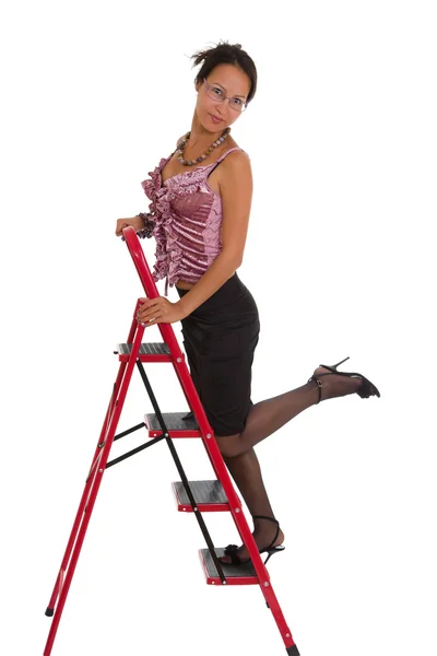 梯子上的商界女强人 免版税图库照片