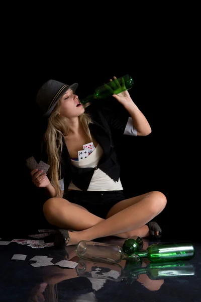 Beautiful womanl with cards and empty bottle — Stock Photo, Image