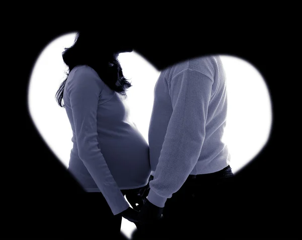 Pregnant couple silhouette in low key — Stock Photo, Image