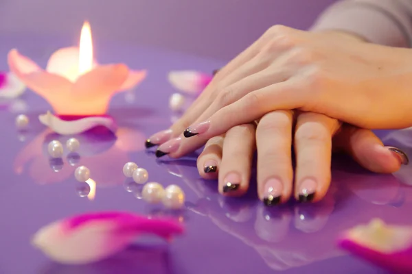 Woman hands with french manicure with crystals — Stock Photo, Image