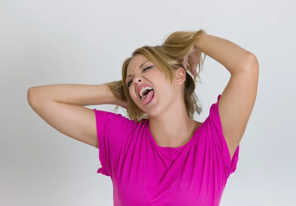 Close up of young woman making funny faces — Stock Photo, Image