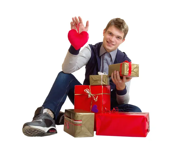 Teenager with heart and gifts isolated — Stock Photo, Image