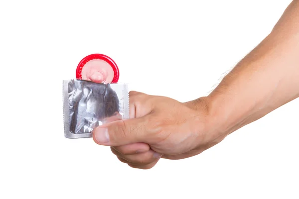 El ile üzerine beyaz izole prezervatif — Stok fotoğraf