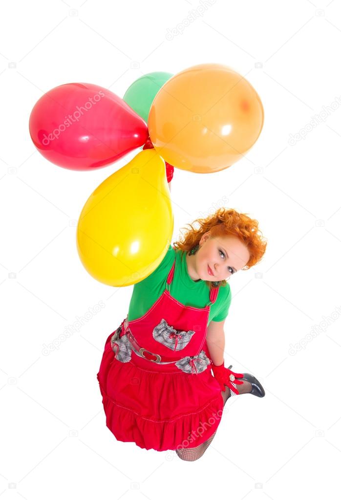 Happy beautiful girl flying with baloons
