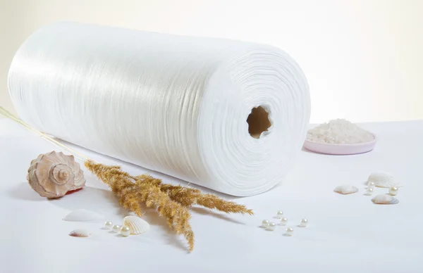 White rolled towel and salt — Stock Photo, Image