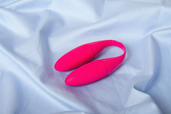 Sex toy on blue fabrick — Stock Photo, Image