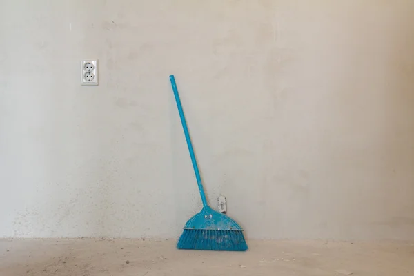 Home under construction - sweeping floor — Stock Photo, Image